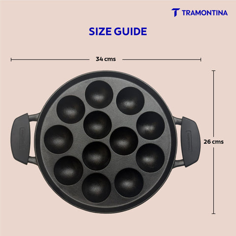 TRAMONTINA Titanex 26 cm Pre-Seasoned Cast Iron Paniyaram/Appe Pan – 12 Pits | Non-Toxic | Induction Ready | Toughned Glass Lid | Snap-on Cool Touch Grips | Superior Heat Retention.